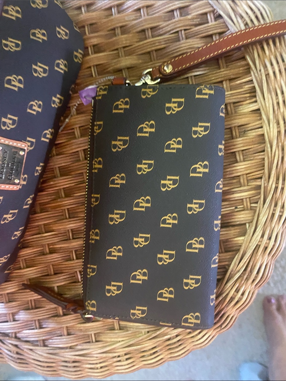 Dooney & Bourke dark brown and Gold Monogram Wristlet